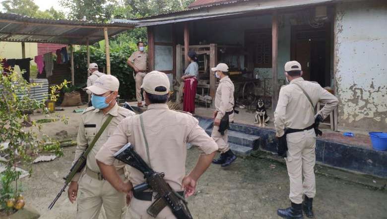 Thoubal police during an anti-alcohol drive at a local alcohol vendor (PHOTO: IFP)