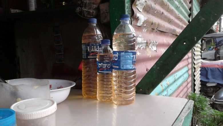 Fuel sold in used mineral bottles at higher prices in roadside shops in Imphal. (PHOTO IFP)