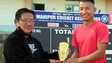 Model Club skipper Karnajit recieving the Man of the Match for his 55 runs knock from MNCA official (PHOTO: IFP)