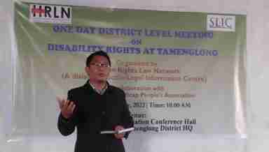 Hillson Angam speaking at a one-day district level meeting on disability rights