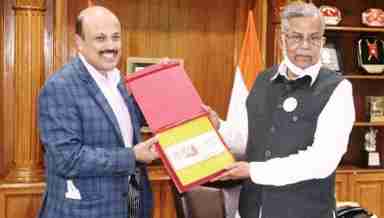 Manipur Chief Electoral Officer Rajesh Agrawal hands over EPIC card to Governor La Ganesan on February 5, 2022 in Imphal