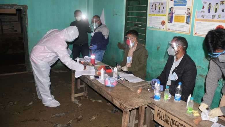 A COVID-19 positive electorate casts his vote in Wangoi AC