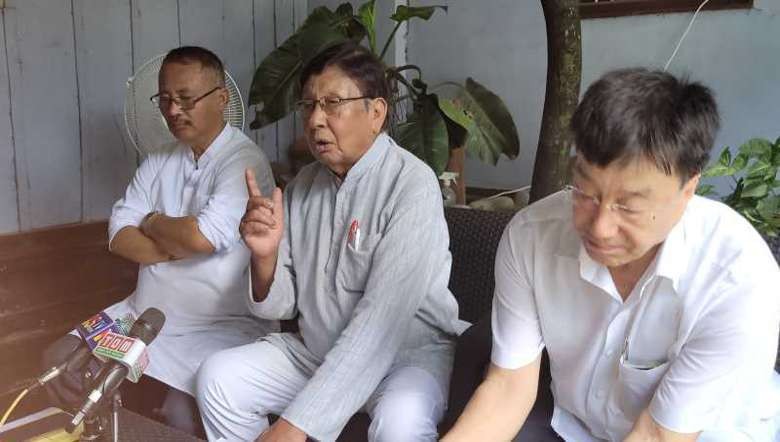 Senior Manipur political leader O Joy (C)