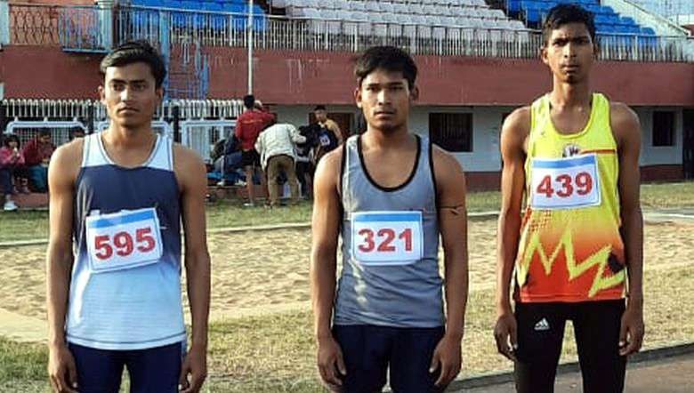 Md Badaruddin (C) who claimed the gold medal in the U-16 Boys 300 meter race