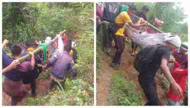 Villagers carrying a pregnant woman in a makeshift bamboo stretcher to hospital in Tamei, Manipur (PHOTO: IFP)