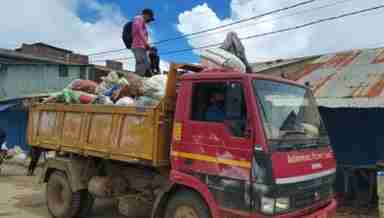 Without basic protective gear, the sanitation workers of ADC Ukhrul go collecting wastes from the town (PHOTO: IFP)