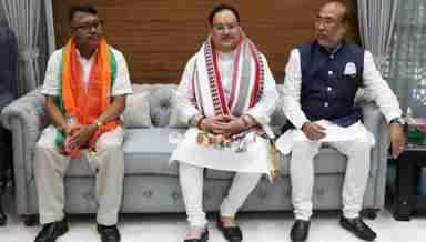 Govindas Konthoujam with BJP president JP Nadda (C) and CM N Biren