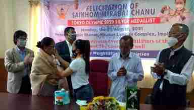 Olympian S.Mirabai Chanu sharing her joyous moment with her coaches during her reception by Manipur Weightlifting Association at Olympic Bhavan, Khuman Lampak. Family members were also present on the occasion (PHPTP: IFP)