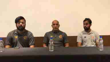 Punjab FC Head Coach Curtis Fleming (C) addresses official pre-match press conference
