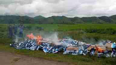 WIN cigarettes seized from two vehicles on August 8, 2020 at Andro, Imphal, being destroyed by local bodies