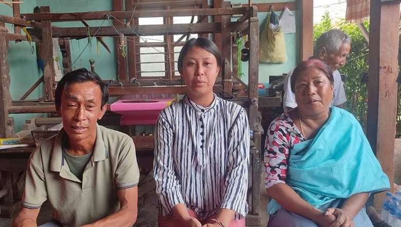 Pushpa Naorem (C), Arts topper, HSE Manipur 2023, with her parents (Photo: IFP)