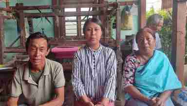 Pushpa Naorem (C), Arts topper, HSE Manipur 2023, with her parents (Photo: IFP)